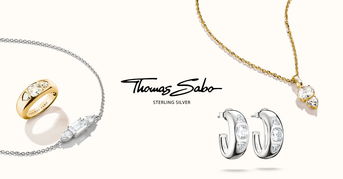 Schmuckkollektion in Gold und Silber mit Kristallen und Markenlogo Thomas Sabo