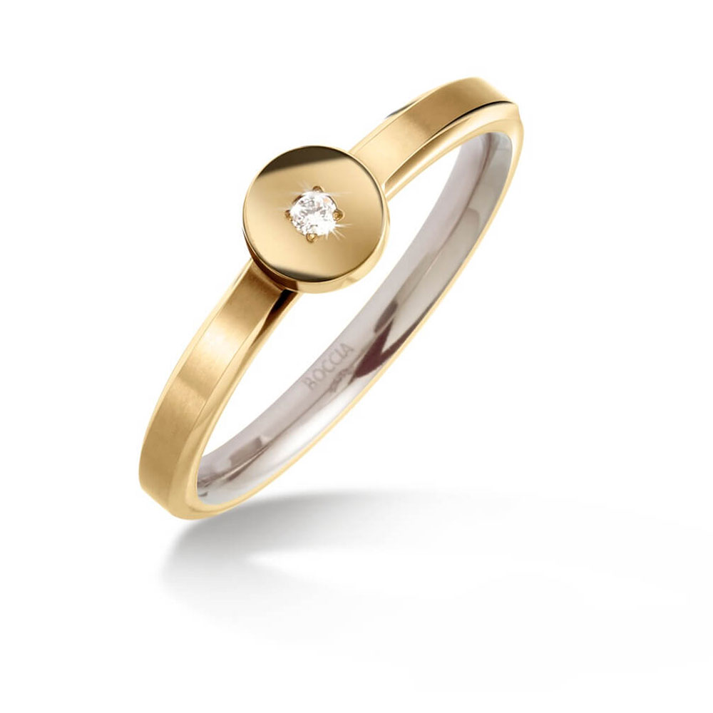 Goldener Ring mit glänzendem Finish und kleinem Diamanten auf Scheibe